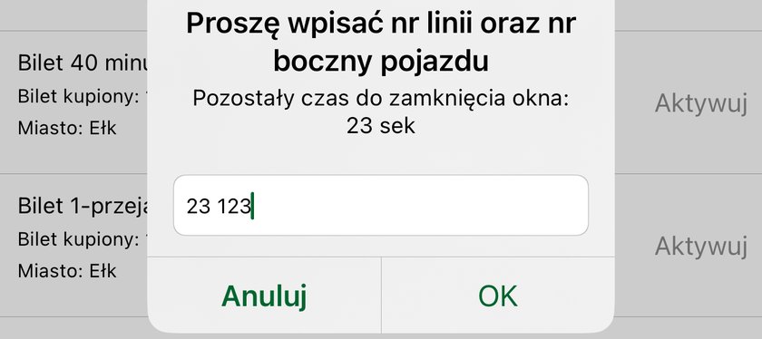Okno aktywacji biletu z Ełku: Proszę wpisać nr linii oraz nr boczny pojazdu, odliczanie czasu, w polu wpisane 23 123 i przyciski Anuluj i OK